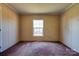 Bedroom featuring a window for natural light and neutral walls and carpets at 828 Carver St, Shelby, NC 28152