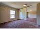 Bright bedroom featuring neutral walls, a large window, and cozy carpeting at 828 Carver St, Shelby, NC 28152