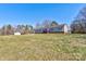 Inviting single-story home featuring horizontal siding, a front porch, and a spacious lawn at 828 Carver St, Shelby, NC 28152