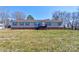 Charming single-story home with neutral siding, red shutters, and a welcoming front porch at 828 Carver St, Shelby, NC 28152