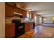 Functional kitchen with modern appliances, ample counter space, and adjacent dining area at 828 Carver St, Shelby, NC 28152