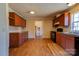 Efficient kitchen layout with essential appliances, wood cabinetry, and laminate countertops at 828 Carver St, Shelby, NC 28152