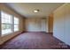 Spacious living room featuring two large windows for natural light and neutral wall tones at 828 Carver St, Shelby, NC 28152