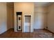 Utility room featuring wood-look floors and a closet with a water heater at 828 Carver St, Shelby, NC 28152