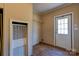 Utility room featuring wood-look floors and a closet with a water heater at 828 Carver St, Shelby, NC 28152