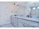 Bathroom with large vanity with double sinks, a grey marble countertop, and matte black hardware at 000 Millstream Rd # 149, Denver, NC 28037