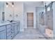 Stylish bathroom with double vanity, a grey marble countertop, and a glass shower at 000 Millstream Rd # 149, Denver, NC 28037