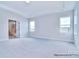 Spacious bedroom with tray ceiling, carpet, and ensuite bathroom with tiled shower at 000 Millstream Rd # 149, Denver, NC 28037