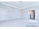 Carpeted Primary bedroom with tray ceilings and a doorway to the bathroom at 000 Millstream Rd # 149, Denver, NC 28037