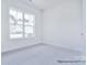 Bright bedroom with carpet, large window and plenty of natural light at 000 Millstream Rd # 149, Denver, NC 28037