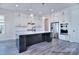 The bright kitchen showcases a center island, modern appliances, and ample cabinet space at 000 Millstream Rd # 149, Denver, NC 28037