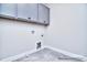 Clean laundry room featuring tile flooring, cabinets for storage, and laundry hook-ups at 000 Millstream Rd # 149, Denver, NC 28037