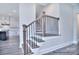 Classic staircase features wood railing with black iron spindles, and wood stairs at 000 Millstream Rd # 149, Denver, NC 28037