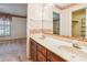 Traditional bathroom with double sinks, vanity, floral wallpaper, and large mirror at 1007 Wentworth Dr, Kannapolis, NC 28081