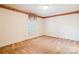 Spacious carpeted bedroom with a window and decorative wallpaper border at 1007 Wentworth Dr, Kannapolis, NC 28081