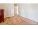 Bright bedroom with neutral carpet, white walls, and paneled doors at 1007 Wentworth Dr, Kannapolis, NC 28081