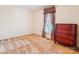 Cozy bedroom features neutral carpet, natural light, and classic wooden dresser at 1007 Wentworth Dr, Kannapolis, NC 28081