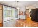 Cozy eat-in kitchen featuring wood floors and a view to the sunroom at 1007 Wentworth Dr, Kannapolis, NC 28081