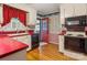 Functional kitchen with red countertops, white cabinetry, and a view to the back door at 1007 Wentworth Dr, Kannapolis, NC 28081