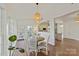 Cozy breakfast nook with a view to the side yard and an adjacent kitchen at 105 Fox Ridge Ln, Mount Holly, NC 28120