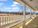 New back porch overlooking the pond and backyard, perfect for relaxing and enjoying the outdoors at 107 Sunderland Dr, Shelby, NC 28150