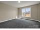Bright bedroom with carpeted floors and a large window offering plenty of natural light at 107 Sunderland Dr, Shelby, NC 28150