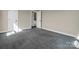 Bedroom featuring neutral walls, carpet flooring, and a door leading to an adjacent room at 107 Sunderland Dr, Shelby, NC 28150