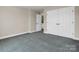 Bedroom featuring neutral walls, carpet flooring, and a closet with double doors at 107 Sunderland Dr, Shelby, NC 28150