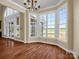 Bright breakfast nook featuring a chandelier, large windows, and hardwood floors creating a sunny space at 107 Sunderland Dr, Shelby, NC 28150
