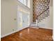 Bright foyer with hardwood floors, a staircase, and high ceilings creates an inviting entry at 107 Sunderland Dr, Shelby, NC 28150