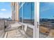 Relax on this cozy balcony with a table and chairs, perfect for enjoying city views at 1133 Metropolitan Ave # 310, Charlotte, NC 28204