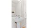 Bright bathroom features a pedestal sink, modern fixtures, and a clean, minimalist design at 1133 Metropolitan Ave # 310, Charlotte, NC 28204