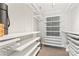 Well-organized walk-in closet featuring custom shelving and ample storage options at 1133 Metropolitan Ave # 310, Charlotte, NC 28204