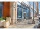Inviting coffee shop exterior with outdoor seating and sunlit storefront windows at 1133 Metropolitan Ave # 310, Charlotte, NC 28204