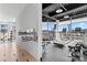 Well-equipped fitness center with treadmills, weights, and large windows offering a view at 1133 Metropolitan Ave # 310, Charlotte, NC 28204