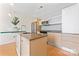 Contemporary kitchen boasts granite countertops, stainless steel appliances, and a sleek island for meal preparation at 1133 Metropolitan Ave # 310, Charlotte, NC 28204