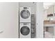 Convenient laundry area with stackable washer and dryer units and storage solutions at 1133 Metropolitan Ave # 310, Charlotte, NC 28204