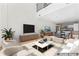 Spacious living room features an entertainment center with open floorplan to the kitchen at 1133 Metropolitan Ave # 310, Charlotte, NC 28204