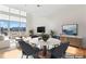 Bright open-concept living area with floor to ceiling windows and modern decor at 1133 Metropolitan Ave # 310, Charlotte, NC 28204