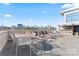 Relax on the rooftop terrace with city skyline views and enjoy the outdoor bar and kitchen at 1133 Metropolitan Ave # 310, Charlotte, NC 28204