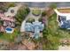 Stunning aerial view of estate showcasing a pool, manicured landscaping, and circular driveway at 131 The Point Dr, Mooresville, NC 28117