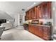 Finished basement features custom cabinetry, beverage cooler, and display area at 131 The Point Dr, Mooresville, NC 28117