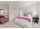 Cozy bedroom featuring bright decor, paneled walls, and a comfortable bed, creating a relaxing retreat at 131 The Point Dr, Mooresville, NC 28117