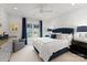 Stylish bedroom features bold wallpaper, dark wood accents, and plush bedding for a luxurious and comfortable space at 131 The Point Dr, Mooresville, NC 28117
