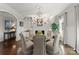 Bright dining room featuring a marble fireplace and elegant chandelier at 131 The Point Dr, Mooresville, NC 28117