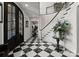 Elegant foyer features a grand staircase and black and white marble floors at 131 The Point Dr, Mooresville, NC 28117