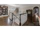 Elegant foyer features hardwood floors, curved staircase, and decorative chandelier, leading to the rest of the home at 131 The Point Dr, Mooresville, NC 28117