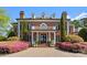 Elegant brick home with a covered front entrance and lush landscaping at 131 The Point Dr, Mooresville, NC 28117