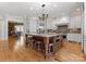 Open-concept kitchen featuring a large island with seating and modern appliances at 13215 Claysparrow Rd, Charlotte, NC 28278