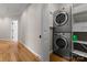 Convenient laundry room with a stacked washer and dryer at 13215 Claysparrow Rd, Charlotte, NC 28278